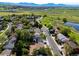 Aerial view of home's location near open spaces with mountain views at 3238 W 11Th Avenue Pl, Broomfield, CO 80020