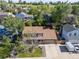 Aerial view of a neatly landscaped home with a large backyard and a long driveway, nestled in a quiet neighborhood at 3238 W 11Th Avenue Pl, Broomfield, CO 80020