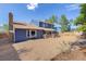 Exterior elevation of home with gravel backyard at 3238 W 11Th Avenue Pl, Broomfield, CO 80020