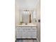 Neat powder room boasting a large vanity and a mirrored medicine cabinet at 3238 W 11Th Avenue Pl, Broomfield, CO 80020