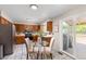 Charming kitchen with stainless steel appliances, wood cabinetry, and a cozy breakfast nook at 3238 W 11Th Avenue Pl, Broomfield, CO 80020