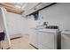 Utility area in the basement with a modern washer and dryer at 3238 W 11Th Avenue Pl, Broomfield, CO 80020