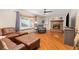 Inviting living room with hardwood floors, a brick fireplace, and a large bay window at 3238 W 11Th Avenue Pl, Broomfield, CO 80020