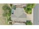 Aerial view of a home with a gray roof, patio furniture, and manicured landscaping at 21064 Woodside Ln, Parker, CO 80138