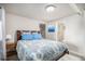 Inviting bedroom featuring a comfortable bed and convenient access to an ensuite bathroom at 21064 Woodside Ln, Parker, CO 80138