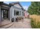 Charming front entrance featuring beautiful stone stairs, a delightful flower box, and an American flag at 21064 Woodside Ln, Parker, CO 80138