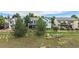 Aerial view of a home with a beautiful wooden fence, mature trees, and grass at 21064 Woodside Ln, Parker, CO 80138