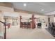 Spacious finished basement with a bar area, pool table, and carpeted floors at 7035 S Picadilly St, Aurora, CO 80016