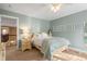 Comfortable bedroom featuring a ceiling fan, soft blue walls, and warm carpet, creating a serene retreat at 7035 S Picadilly St, Aurora, CO 80016