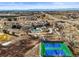 Aerial view of community amenities, including a pool, tennis courts, and green spaces at 7035 S Picadilly St, Aurora, CO 80016
