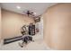 Exercise room featuring a ceiling fan, exercise equipment, and a mounted TV at 7035 S Picadilly St, Aurora, CO 80016