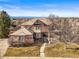 Charming single-Gathering home features a well-manicured lawn and a grand entrance with an arched doorway at 7035 S Picadilly St, Aurora, CO 80016