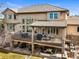 A multi-tiered outdoor deck showcases ample seating and entertaining areas, providing the perfect space to unwind at 7035 S Picadilly St, Aurora, CO 80016