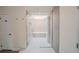 Updated bathroom features a glass shower with stylish tile, modern fixtures and natural light at 1165 N Pennsylvania St # 3B, Denver, CO 80203