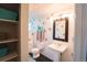 Updated bathroom featuring white tile, a pedestal sink, and ample storage space in built-in shelving at 1165 N Pennsylvania St # 3B, Denver, CO 80203