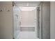 The updated bathroom features an expansive glass shower with a bench and natural light at 1165 N Pennsylvania St # 3B, Denver, CO 80203