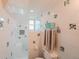 Bright bathroom featuring shower, mosaic tile accents, and convenient towel rack, creating a fresh, clean design at 1165 N Pennsylvania St # 3B, Denver, CO 80203
