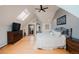 Bedroom featuring hardwood floors, a ceiling fan and a walk-in closet at 1165 N Pennsylvania St # 3B, Denver, CO 80203