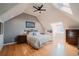 Bright bedroom features a ceiling fan, skylight and an ensuite bathroom at 1165 N Pennsylvania St # 3B, Denver, CO 80203