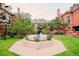 Beautiful courtyard view shows the apartments brick exterior and fountain that offers a communal gathering space at 1165 N Pennsylvania St # 3B, Denver, CO 80203