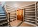 Inviting foyer with custom built-in shelving, mosaic-tiled floors and hardwood door at 1165 N Pennsylvania St # 3B, Denver, CO 80203