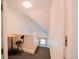 Upstairs hallway with a small table and chair by the landing at 1165 N Pennsylvania St # 3B, Denver, CO 80203