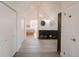 Spacious hallway leading to the bedroom featuring closet storage and dual vanities at 1165 N Pennsylvania St # 3B, Denver, CO 80203