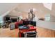 Open-concept living room featuring a stone fireplace and elegant spiral staircase, perfect for modern living at 1165 N Pennsylvania St # 3B, Denver, CO 80203