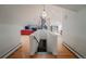 Bright living room features a spiral staircase, fireplace, and hardwood floors for a modern, open feel at 1165 N Pennsylvania St # 3B, Denver, CO 80203