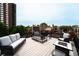 Rooftop deck with comfortable seating and city views at 1165 N Pennsylvania St # 3B, Denver, CO 80203
