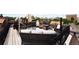 Beautiful rooftop deck with seating and decorative iron railing, perfect for entertaining or relaxing outdoors at 1165 N Pennsylvania St # 3B, Denver, CO 80203