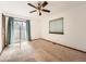 Bedroom featuring a ceiling fan, window and sliding door to the exterior at 9477 W 89Th Cir, Broomfield, CO 80021