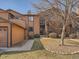 The exterior showcases wood siding, a gravel garden, sidewalk and stairs to an upper level unit at 9477 W 89Th Cir, Broomfield, CO 80021