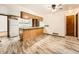 Bright kitchen with wooden cabinets and white appliances at 9477 W 89Th Cir, Broomfield, CO 80021