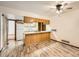 Bright kitchen with wooden cabinets and a ceiling fan at 9477 W 89Th Cir, Broomfield, CO 80021