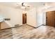Living room area with wood-look flooring and a ceiling fan at 9477 W 89Th Cir, Broomfield, CO 80021