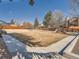 Community playground surrounded by grass and a basketball court at 9477 W 89Th Cir, Broomfield, CO 80021