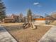Community playground with a slide and seating for children to play at 9477 W 89Th Cir, Broomfield, CO 80021