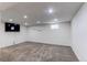 Finished basement boasts recessed lights, a small window, neutral paint, and carpeted floor at 6120 W 111Th Ave, Westminster, CO 80020