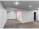 A finished basement features a small window, neutral paint and carpeted floor at 6120 W 111Th Ave, Westminster, CO 80020