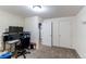 Bedroom features neutral walls, carpet, closet, and desk at 6120 W 111Th Ave, Westminster, CO 80020