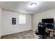 Bedroom features neutral walls, carpet, a window, and desk at 6120 W 111Th Ave, Westminster, CO 80020