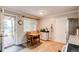 Eat-in kitchen features tile floor, a table with seating for two, and view to the backyard at 6120 W 111Th Ave, Westminster, CO 80020