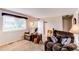 Comfortable living room with plush seating, a large window, and neutral decor at 6120 W 111Th Ave, Westminster, CO 80020