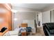 Organized office area with bright lighting, storage solutions, and easy access to adjacent rooms at 6120 W 111Th Ave, Westminster, CO 80020