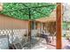 Relaxing covered patio area with outdoor seating and shade umbrella, perfect for enjoying the outdoors at 6120 W 111Th Ave, Westminster, CO 80020