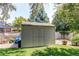 Backyard storage shed in backyard with manicured garden and lawn at 6120 W 111Th Ave, Westminster, CO 80020