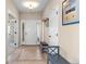 Inviting foyer with tiled flooring, bench seating, and a coat rack for added convenience at 28340 Dylon Cir, Elizabeth, CO 80107