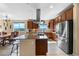Spacious kitchen with granite countertops, stainless steel appliances, and an expansive island cooktop at 28340 Dylon Cir, Elizabeth, CO 80107