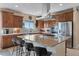 Stunning kitchen showcasing a large center island with a cooktop and stylish barstool seating at 28340 Dylon Cir, Elizabeth, CO 80107